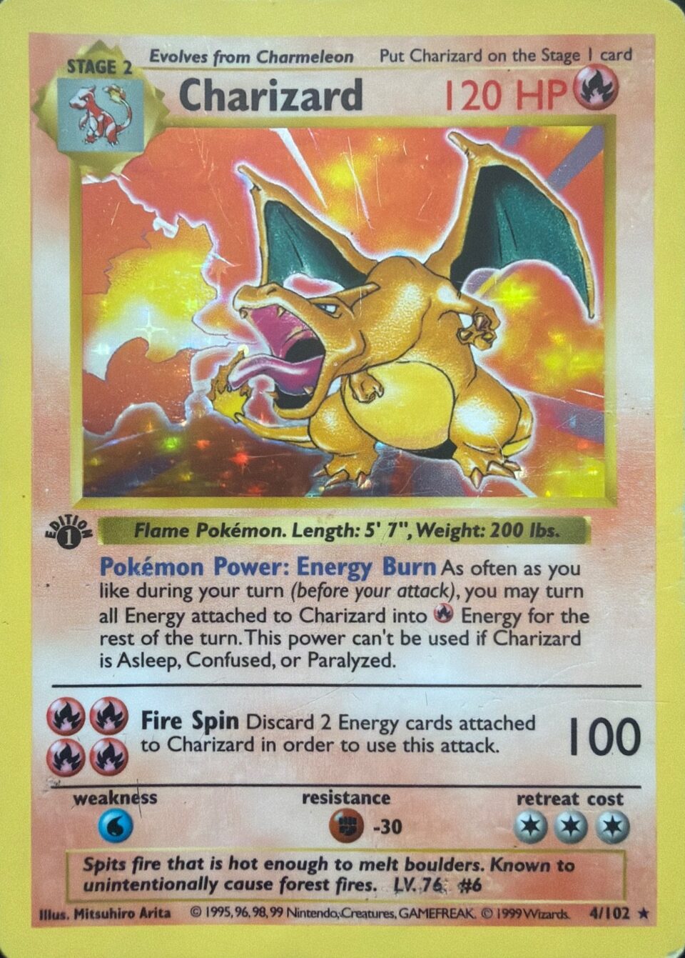 The lower left of the 1st Edition Charizard's art box, enlarged: the black 1st Edition stamp sits just below it.